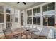 Screened porch with a table and chairs, offering backyard views at 1034 Bradbury Ln, Charleston, SC 29492