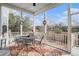 Screened porch with outdoor seating, overlooking a tranquil backyard at 1034 Bradbury Ln, Charleston, SC 29492