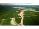 Aerial view of new home community development with lots and ponds at 114 Lilac Grove Way, Summerville, SC 29486