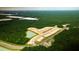 Aerial view of new home community development with lots and ponds at 114 Lilac Grove Way, Summerville, SC 29486