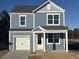 Two-story house featuring gray siding, white accents, and a two-car garage at 114 Lilac Grove Way, Summerville, SC 29486