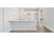 Modern kitchen with white cabinets and quartz countertops at 114 Lilac Grove Way, Summerville, SC 29486