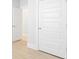 Hallway with light gray walls, white doors and vinyl flooring at 116 Lilac Grove Way, Summerville, SC 29486