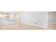 Open living space with wood floors and access to other rooms at 116 Lilac Grove Way, Summerville, SC 29486