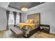 Spacious primary bedroom with plush bedding and large windows at 117 Upper Trestles Ave, Summerville, SC 29483