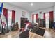 bedroom with a dark wood bed and red curtains at 117 Upper Trestles Ave, Summerville, SC 29483