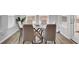 Bright dining area with a marble table and six cushioned chairs at 117 Upper Trestles Ave, Summerville, SC 29483