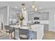 Modern kitchen with gray cabinets and large island at 117 Upper Trestles Ave, Summerville, SC 29483