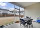 Screened porch with table and chairs, overlooking backyard at 117 Upper Trestles Ave, Summerville, SC 29483