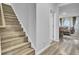 Modern staircase with wood-look laminate flooring at 117 Upper Trestles Ave, Summerville, SC 29483