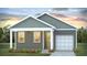Gray exterior with white trim, one car garage, and landscaping at 118 Midmills Ln, Summerville, SC 29486