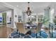 Formal dining room with a round table and large windows at 120 Camelia Park Ln, Summerville, SC 29486