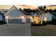 Gray two-story house with gray double garage doors and palm trees at 120 Camelia Park Ln, Summerville, SC 29486