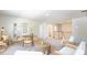 Bright bonus room with seating area, table, and access to bathroom and stairs at 126 Lilac Grove Way, Summerville, SC 29486