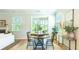 Bright dining area with a round table and four chairs, near sliding glass doors at 126 Lilac Grove Way, Summerville, SC 29486
