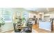 Charming dining area with round table and chairs, adjacent to kitchen at 126 Lilac Grove Way, Summerville, SC 29486