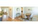 Bright dining room with hardwood floors and a rustic wooden table at 126 Lilac Grove Way, Summerville, SC 29486