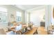 Open concept dining room with hardwood floors, neutral walls and large windows at 126 Lilac Grove Way, Summerville, SC 29486