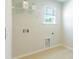 Clean laundry room with tile floor and shelving at 126 Lilac Grove Way, Summerville, SC 29486