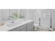 Modern bathroom with dual sinks, a large shower, and grey cabinets at 129 Lilac Grove Way, Summerville, SC 29486