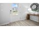 Modern entryway with a console table and mirror, hardwood floors at 129 Lilac Grove Way, Summerville, SC 29486