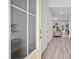 Bright entryway with light yellow door and view into the living room at 129 Lilac Grove Way, Summerville, SC 29486