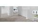 Upstairs hallway with carpet, and a view into a bedroom at 129 Lilac Grove Way, Summerville, SC 29486