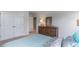 Well-lit bedroom with double doors and dresser at 132 Lilac Grove Way, Summerville, SC 29486