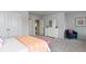 Bright bedroom with carpet, double doors, and a cozy armchair at 132 Lilac Grove Way, Summerville, SC 29486