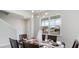 Dining room with a large window and a wood dining table at 132 Lilac Grove Way, Summerville, SC 29486