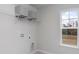 Laundry room with shelving and window at 132 Lilac Grove Way, Summerville, SC 29486