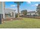 Landscaped backyard with pergola, seating area and privacy fence at 1455 Red Tide Rd, Mount Pleasant, SC 29466