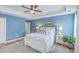 Serene bedroom with a white bed frame and blue walls at 1455 Red Tide Rd, Mount Pleasant, SC 29466