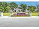 Brigade Hall community entrance with landscaping and a welcoming sign at 1455 Red Tide Rd, Mount Pleasant, SC 29466