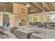 Outdoor fireplace with seating area and picnic tables at 1455 Red Tide Rd, Mount Pleasant, SC 29466