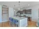 Modern kitchen with an island, stainless steel appliances, and hardwood floors at 1455 Red Tide Rd, Mount Pleasant, SC 29466