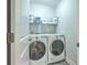 Laundry room with washer, dryer, and shelving for storage at 1455 Red Tide Rd, Mount Pleasant, SC 29466
