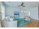 Living room with hardwood floors, comfy seating, and a large TV at 1455 Red Tide Rd, Mount Pleasant, SC 29466
