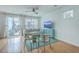 Bright living room with hardwood floors, a ceiling fan, and access to a patio at 1455 Red Tide Rd, Mount Pleasant, SC 29466