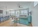 Open living area with hardwood floors, comfy sofas, and a view to the kitchen at 1455 Red Tide Rd, Mount Pleasant, SC 29466