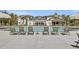 Community pool with lounge chairs and a clubhouse in the background at 1455 Red Tide Rd, Mount Pleasant, SC 29466