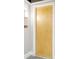 Apartment door with wood finish, and silver door handles at 150 Bee St # 318, Charleston, SC 29401