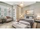 Main bedroom with large window, neutral decor, and built in shelving at 150 Bee St # 318, Charleston, SC 29401