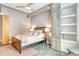 Cozy bedroom with wood bed frame and built-in shelves at 150 Bee St # 318, Charleston, SC 29401