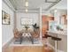 Modern dining area with wood table and chairs, located near kitchen at 150 Bee St # 318, Charleston, SC 29401