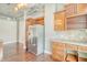 Stainless steel refrigerator with wood cabinets and granite countertops at 150 Bee St # 318, Charleston, SC 29401