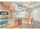 Modern kitchen with stainless steel appliances and wood cabinets at 150 Bee St # 318, Charleston, SC 29401