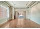 Open living area with polished concrete floors and access to patio at 150 Bee St # 318, Charleston, SC 29401