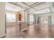 Open concept living room and kitchen with exposed ductwork and concrete floors at 150 Bee St # 318, Charleston, SC 29401