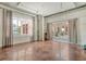 Bright living room with large windows and access to a private patio at 150 Bee St # 318, Charleston, SC 29401